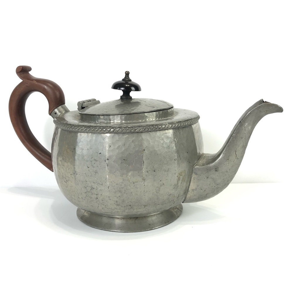 Vintage metal circular teapot of squat bulbous form and wood handle